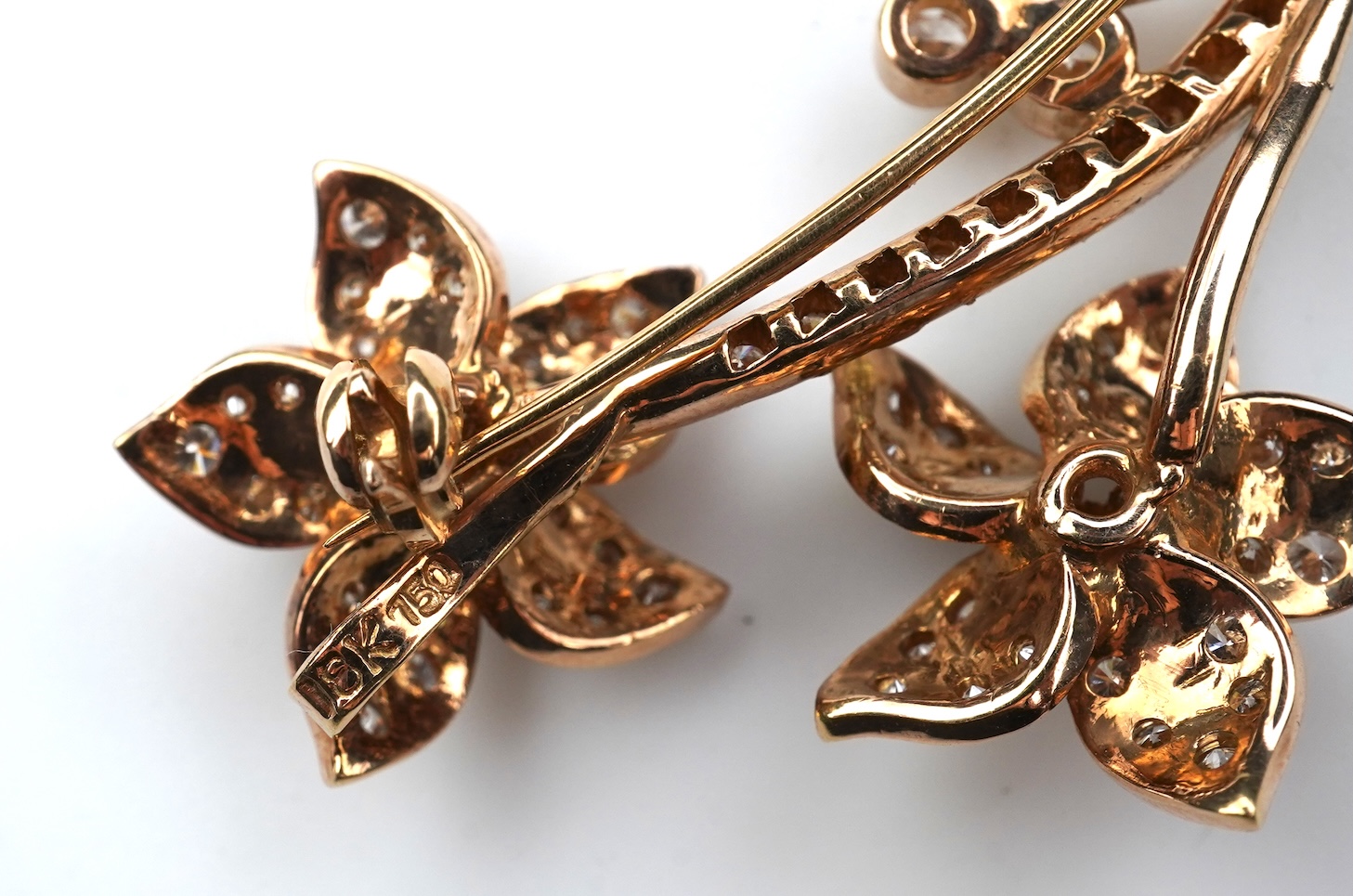 A gold and diamond brooch
